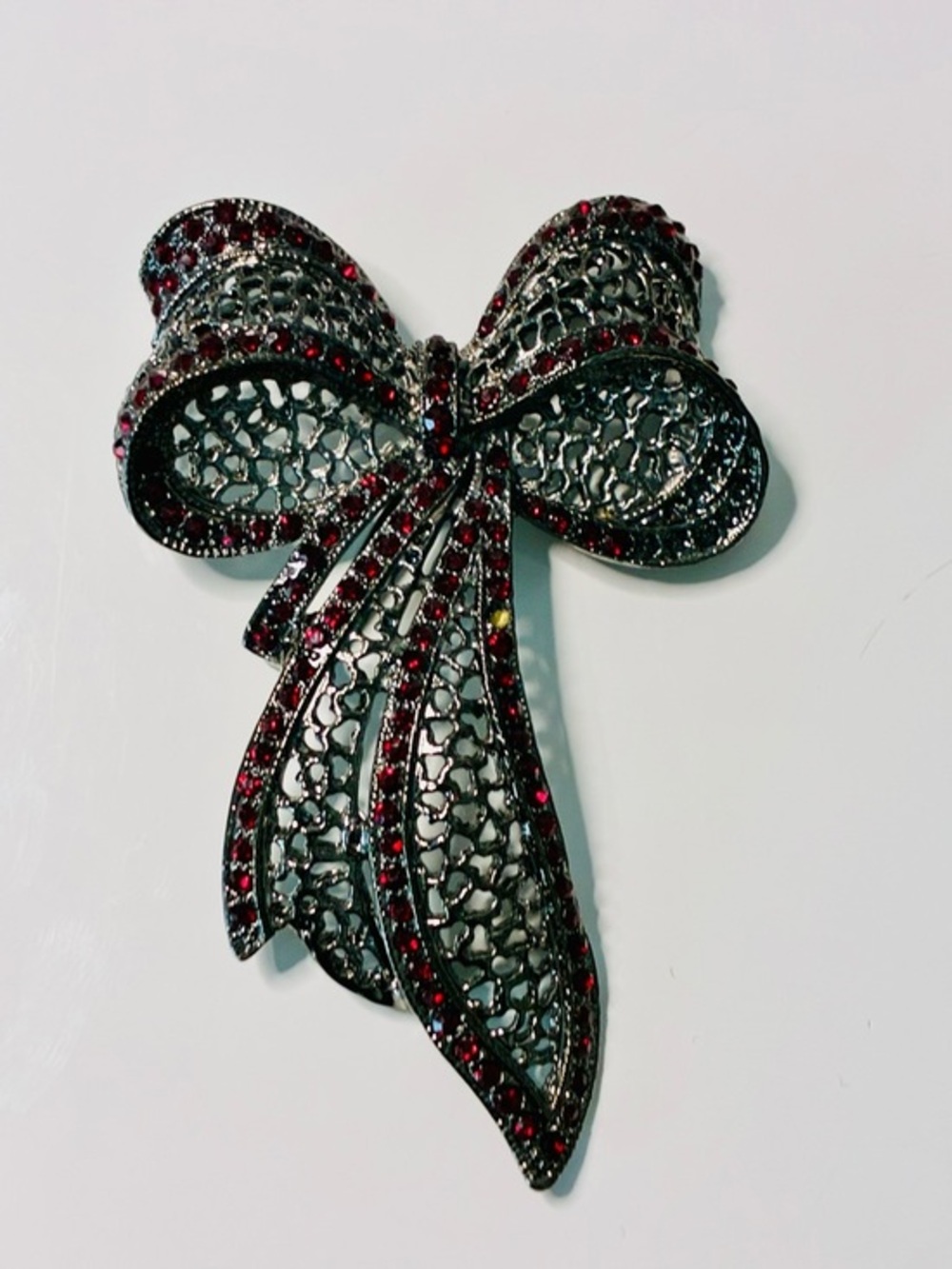 Source Unknown Black Filigree Bow Brooch with Red Stones